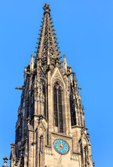 Fototapeta na wymiar Clock tower of the Elisabethenkirche church in Basel, Switzerlan