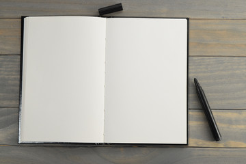 Blank notebook with black felt marker