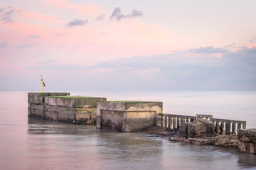Harbour wall projecting into the sea to protect the beach launched fishing fleet at Hastings