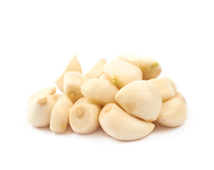 Pile of peeled garlic isolated