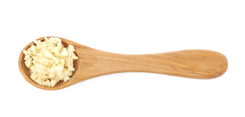 Spoon of minced garlic isolated