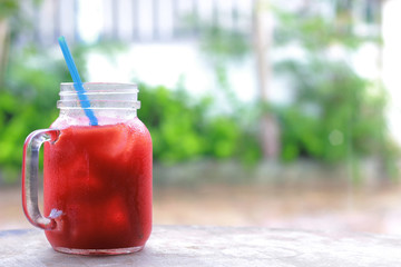 ice tomato juice in cup on background