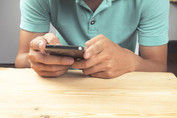 Close up of a man using mobile smart phone