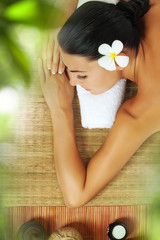 portrait of young beautiful woman relaxing in spa environment