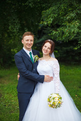 Young happy bride and groom on their wedding. Marriage concept