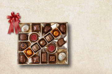 Close up view of chocolate candy on color background