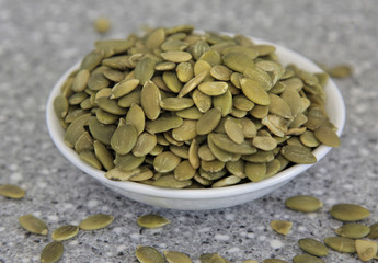 pumpkin seeds in a bowl on the table