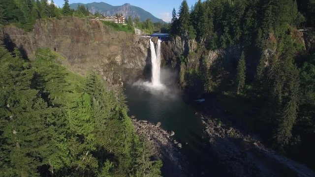 Beautiful Aerial of Pacific Northwest Landmark Snoqualmie Falls and Mount Si in Background