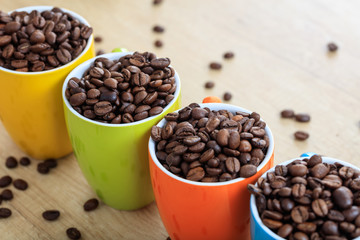 Cups full of coffee beans
