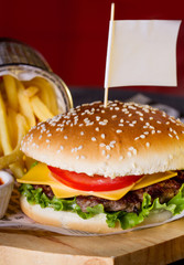 Appetizing hamburger and fried potatoes