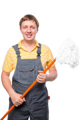 happy man in overalls holding a mop on a white background isolat