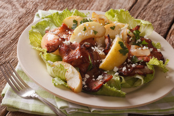 Delicious salad with fried bacon, onion, stewed apple and goat cheese. Horizontal
