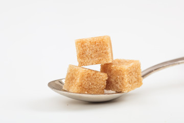 Sugar cubes in a spoon