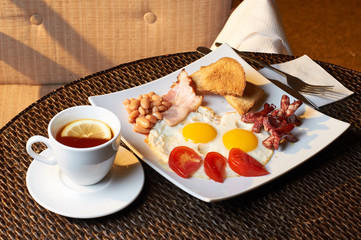 Delicious and hearty breakfasts. Tea and a lot of food for breakfast.