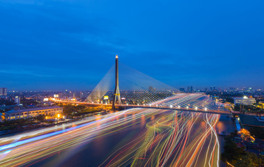 Naklejka premium Rama 8 Bridge crosses Chao Phraya the river with speed light in Bangkok