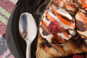 Fresh, golden pancakes with fruit and cream