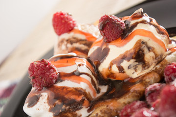 Fresh, golden pancakes with fruit and cream