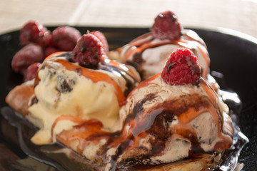 Fresh, golden pancakes with fruit and cream