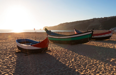 Main beach in Nazare with Traditional boats, Portugal
