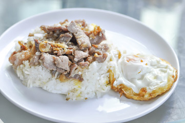 Rice with fried  pork with garlic and black pepper