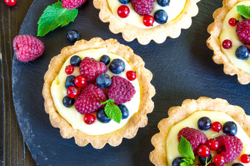 tartlets with custard and berries