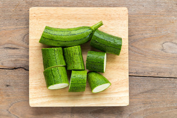 Snake gourd on wooden background