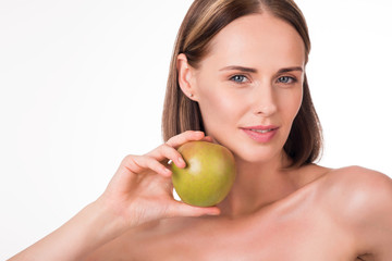 Pretty young woman with green apple