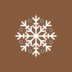 White black winter snowflake on brown background. End of year christmas and sale season.
