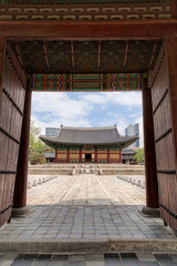 Junghwajeon, the main hall of Deoksugung Palace in Seoul, South Korea, viewed through a gate.