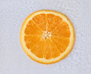 Sun,Sliced halves orange on air bubble in water.