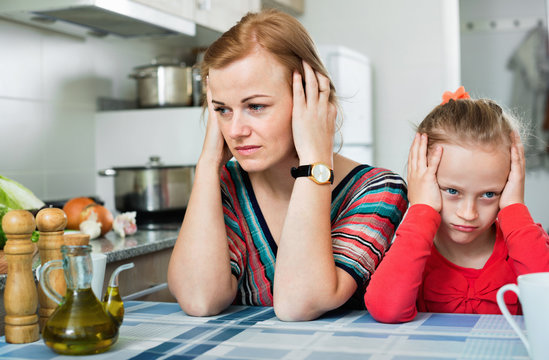 Upset girl and  mother have a peeve on each other