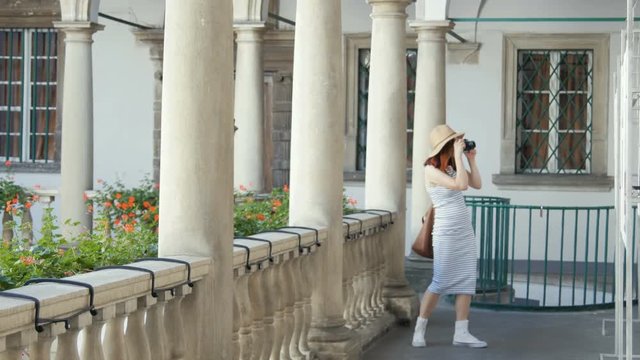 Happy girl making photo with camera