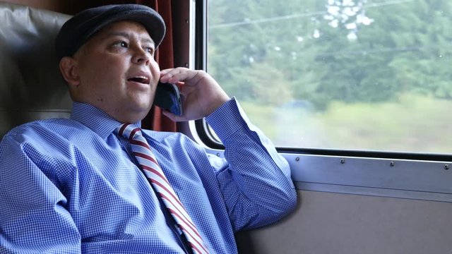 Man using cellphone on train