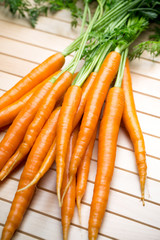 Fresh carrots on the gray backgrounds.