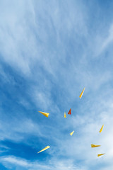rocket paper flying on blue sky.