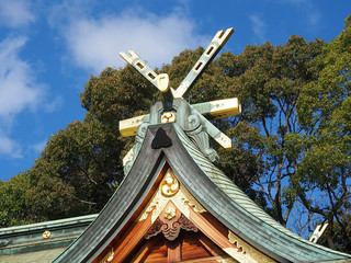 Roof of Shinto shrine building of Nishinomiya Shrine, in winter blue sky.
