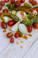 set of vegetables on white wooden background