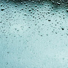 Rainy wet cold blue sky eco seasonal natural background with water drops