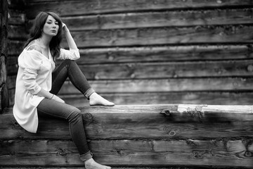 Girl in white shirt and jeans. Black and white photo