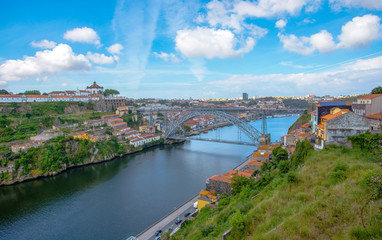 View of the historic city of Porto, Portugal with the Dom Luiz bridge.
