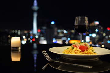 Dinner in front of Auckland city skyline at night