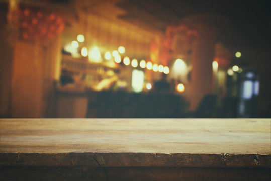 table in front of abstract blurred restaurant lights