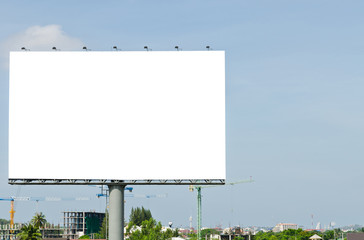 Blank Billboard on the blue sky in the City.