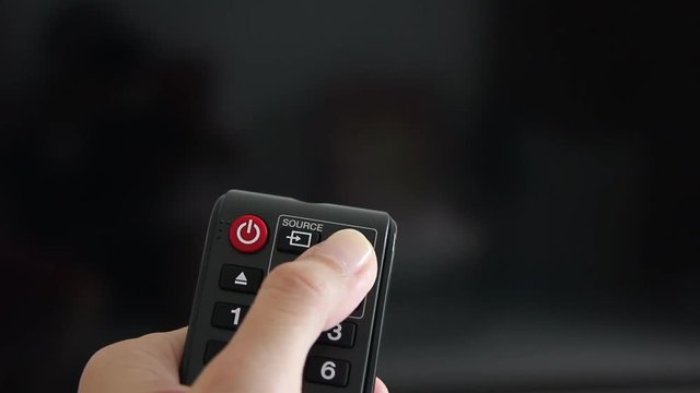 Close Up Shot Asian Woman Hand Using Remote Control To Turn On TV