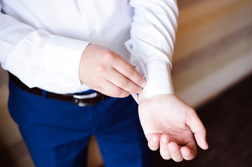 young elegant groom dressed wedding tuxedo costume is waiting for the bride