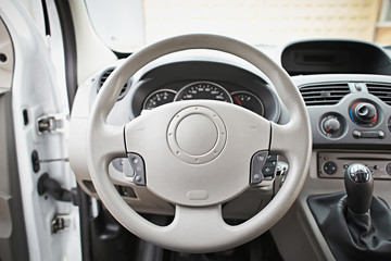 Interior car. Beige steering wheel of the car.