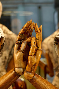two wooden hands