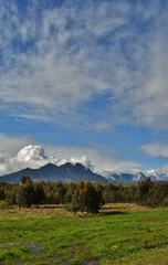 Fototapeta premium Landscape with the Hottentots Holland Mountains and withe clouds in the sky
