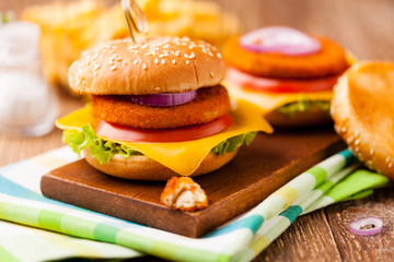 Delicious fish burgerserved with fresh french fries.