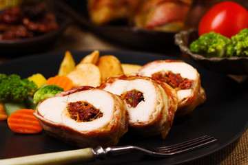 Delicious chicken rolls with dried tomatoes and mozzarella.